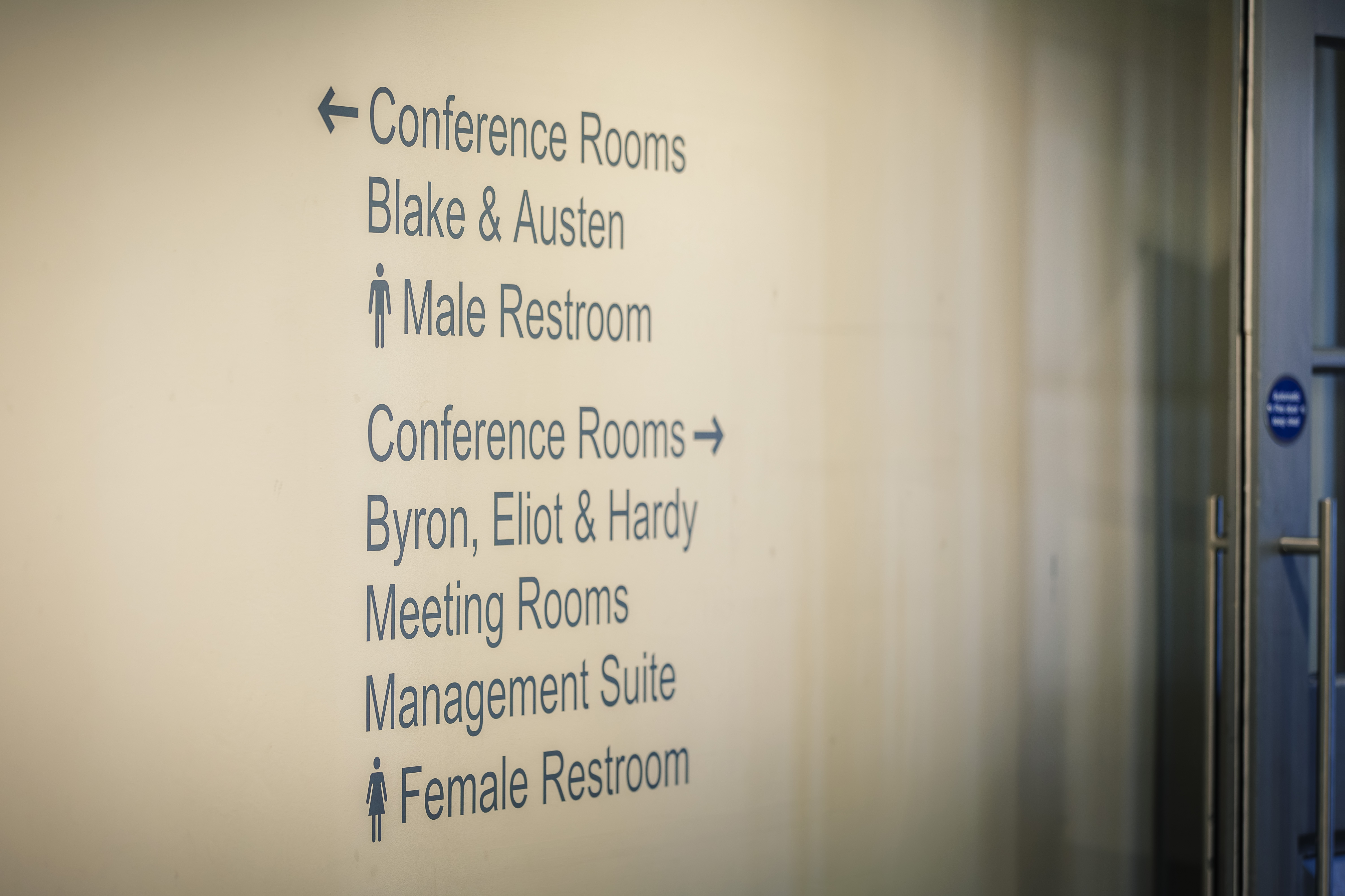 Directional signage pointing to Canham Turner's conference rooms, meeting rooms and other facilities