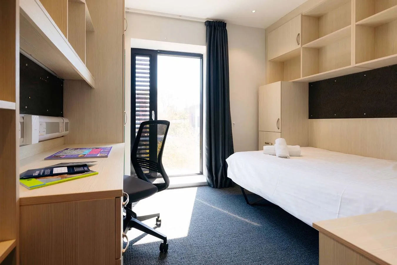 The Courtyard bedroom, equipped with a double bed, desk and large wardrobe