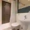 Shower, toilet and sink in The Courtyard