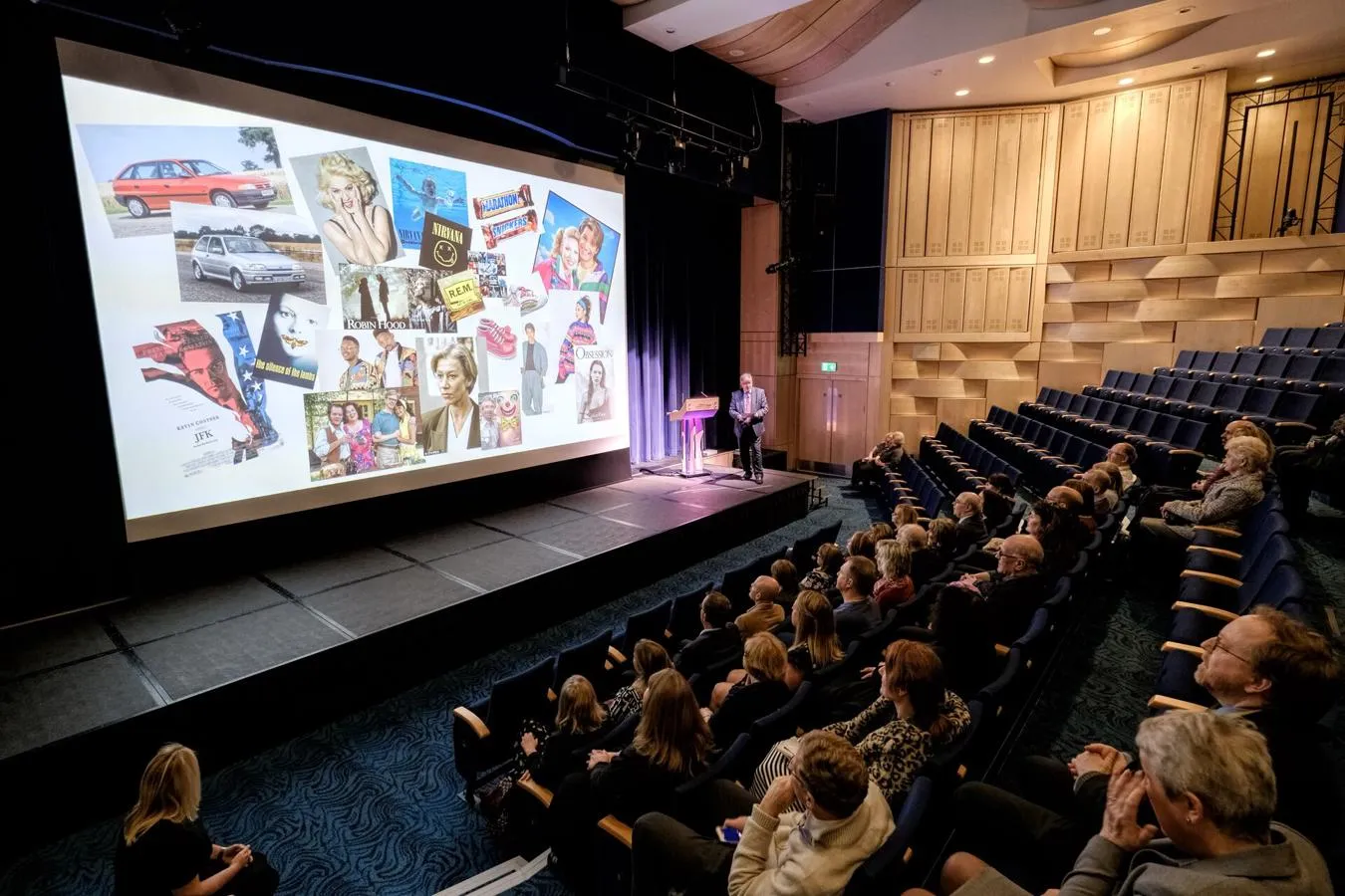 A presentation on a large screen in Middleton Hall