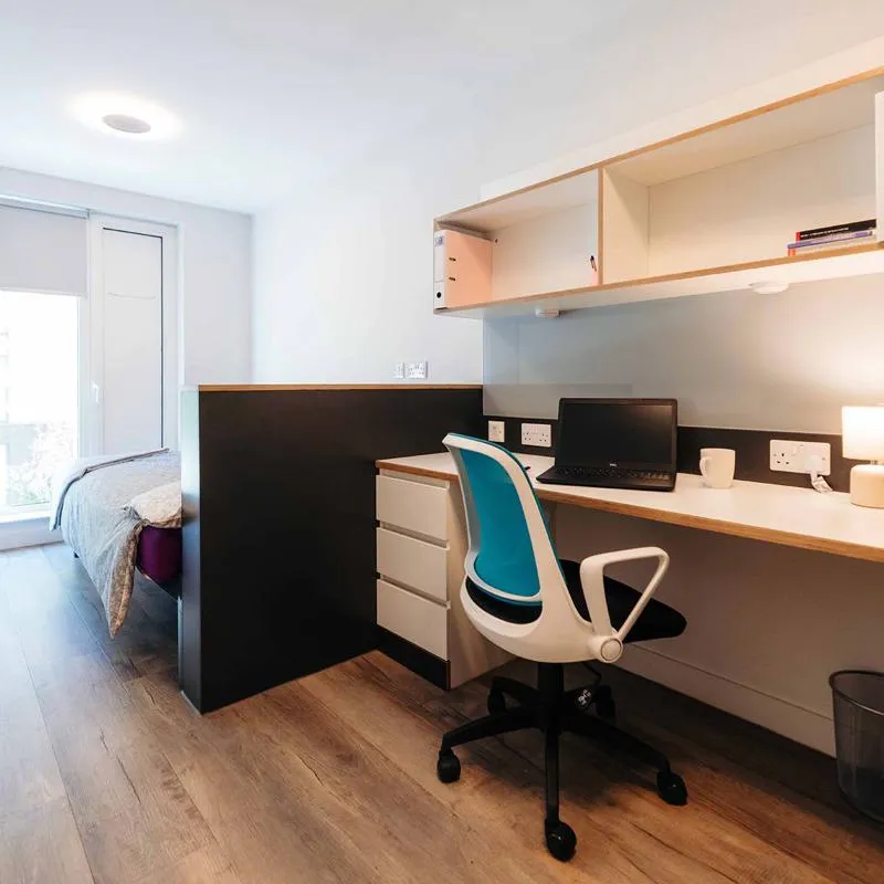 Standard room in Westfield Court with double bed, desk and large wardrobe space